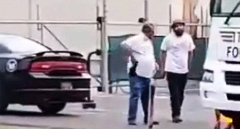 WATCH: Supporter of GOP Senate candidate pulls gun on protesters in Delaware