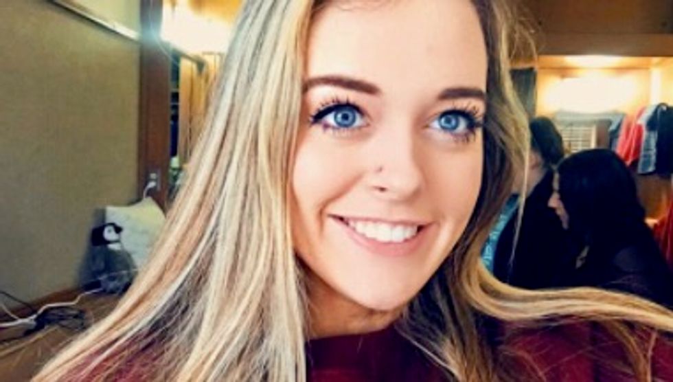 This girl showed a little too much school spirit in the airport security line, and the TSA wasn’t having it