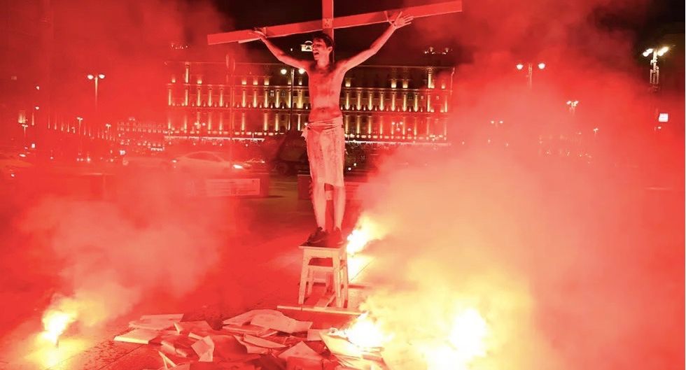 Russian activist jailed for 15 days over crucifixion stunt