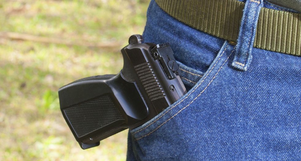 Member of racist group plotting Santa Fe takeover brings gun to council meeting to ‘unnerve’ people