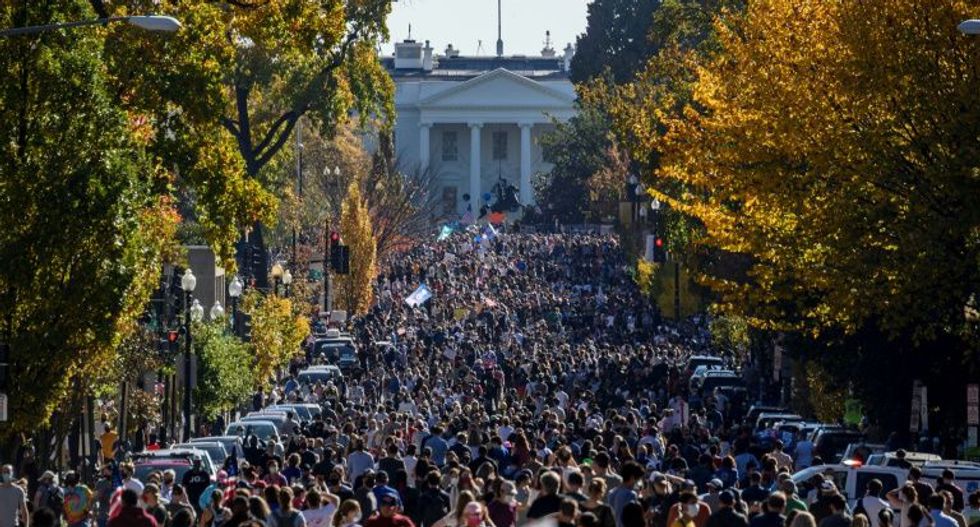 Jubilant Americans celebrate Donald Trump’s electoral defeat at spontaneous celebrations from coast-to-coast