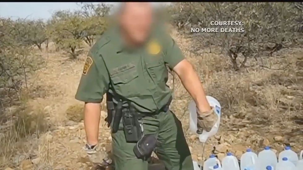 Border patrol arrests activist hours after group releases video of agents dumping water jugs left at border