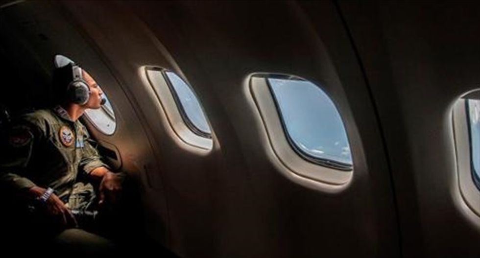 Indonesian officials find items resembling plane door, emergency slide in search for missing AirAsia flight