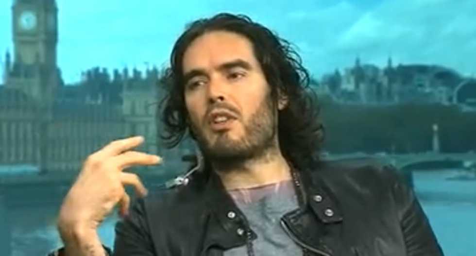 Russell Brand vows not to curse on 'Democracy Now' -- then calls Noam 'Chompsky' a cannibal