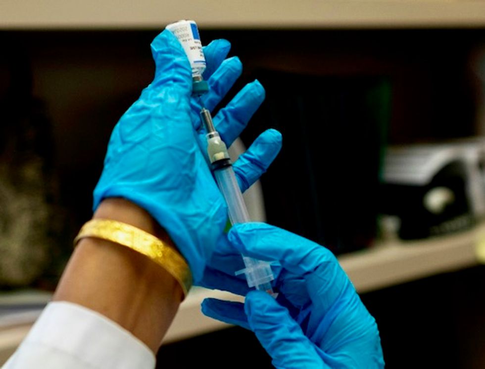 WHO official warns no widespread COVID-19 vaccine expected until mid-2021