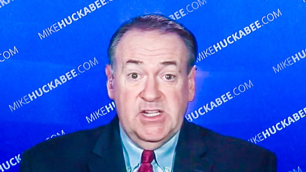 Mike Huckabee tweets out racist joke about Asians eating dogs during Dem debate