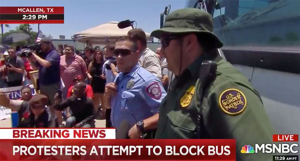 WATCH: Immigrant rights protesters block Border Patrol bus from leaving McAllen detention camp