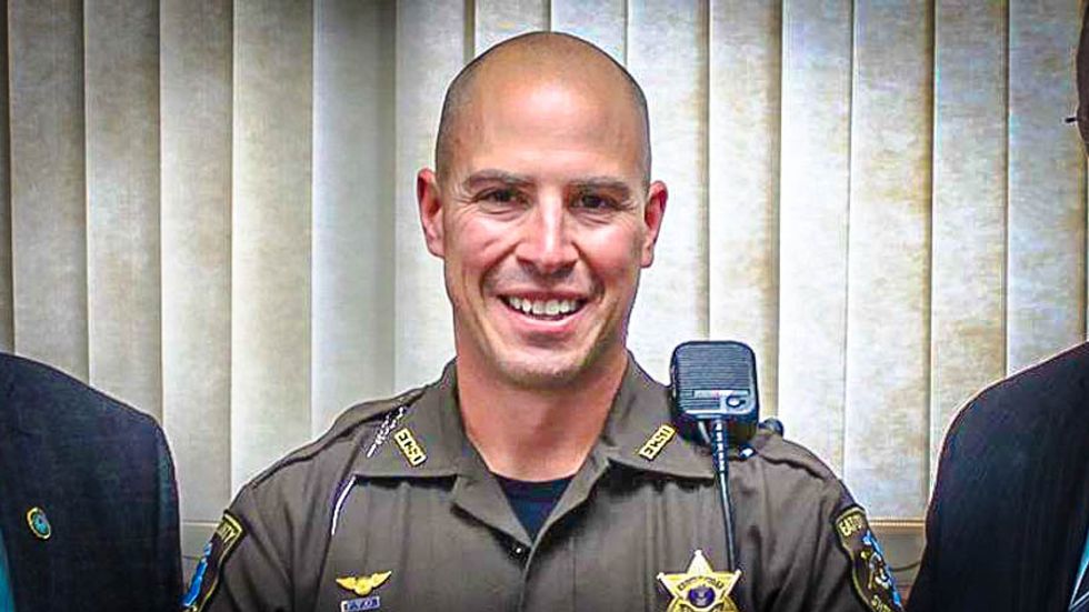 This cop walked after shooting unarmed teen seven times in a road ditch -- now parents are seeking justice