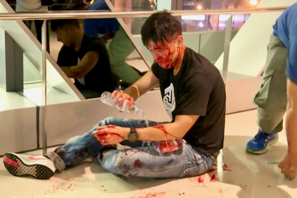 China slams HK airport protesters as 'terrorist-like'