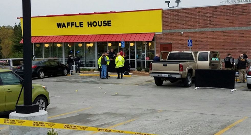 Police hunt for Waffle House gunman who was disarmed by hero after 4 killed