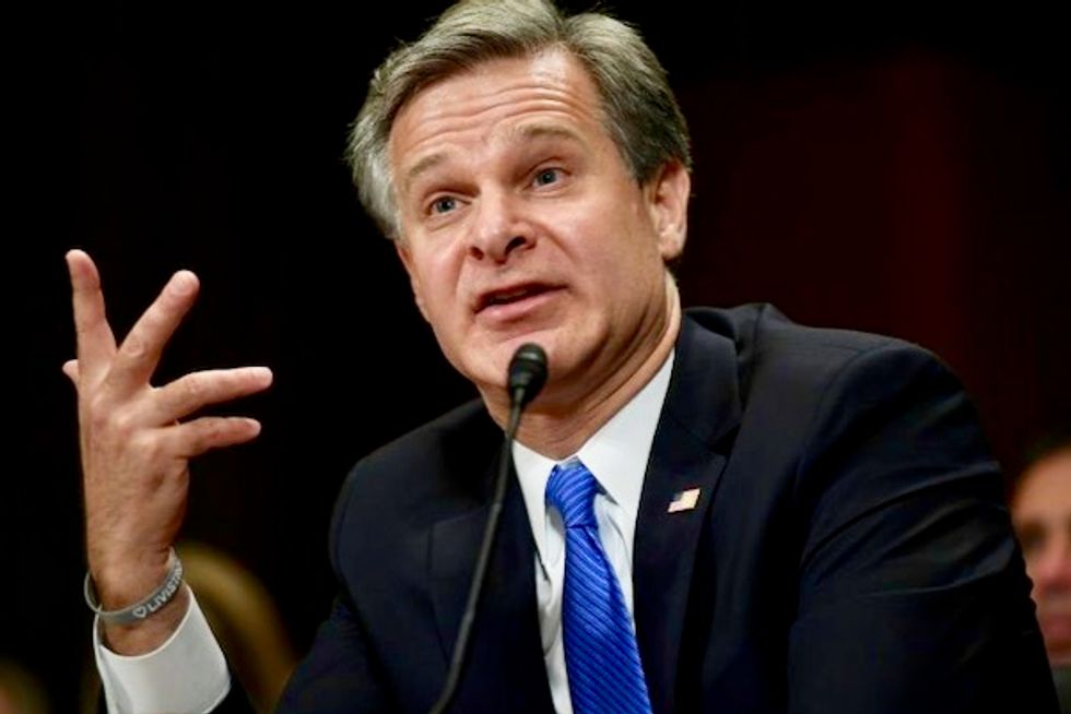 ‘Malign foreign influence’: FBI director warns on Russia’s ‘very active’ efforts to influence election against Biden