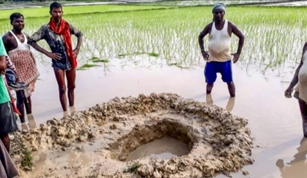 India farmers shocked as suspected meteorite crashes into rice field