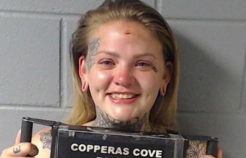 Woman goes into racist meltdown when she’s busted for leaving baby in running car to drink shots in bar