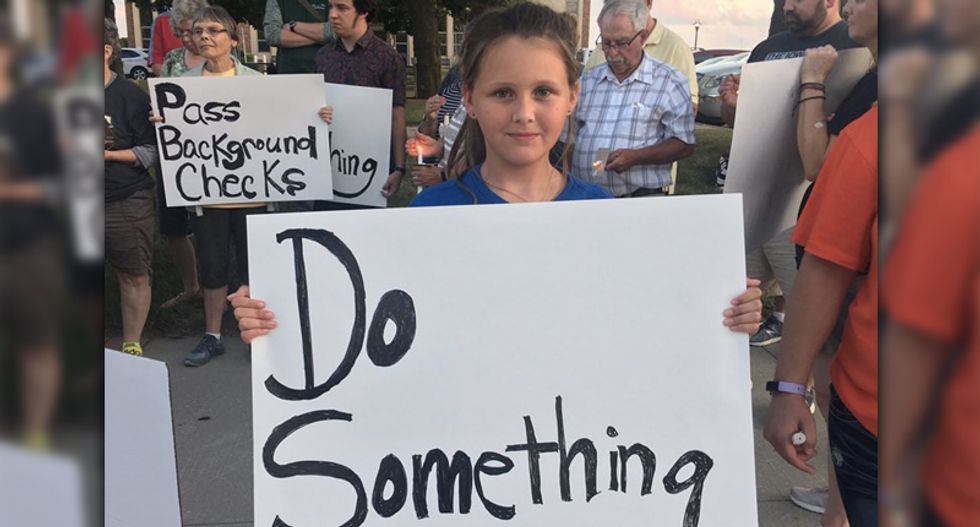 Man screams profanities at 9-year-old girl holding a ‘Do Something’ sign at Iowa gun violence vigil