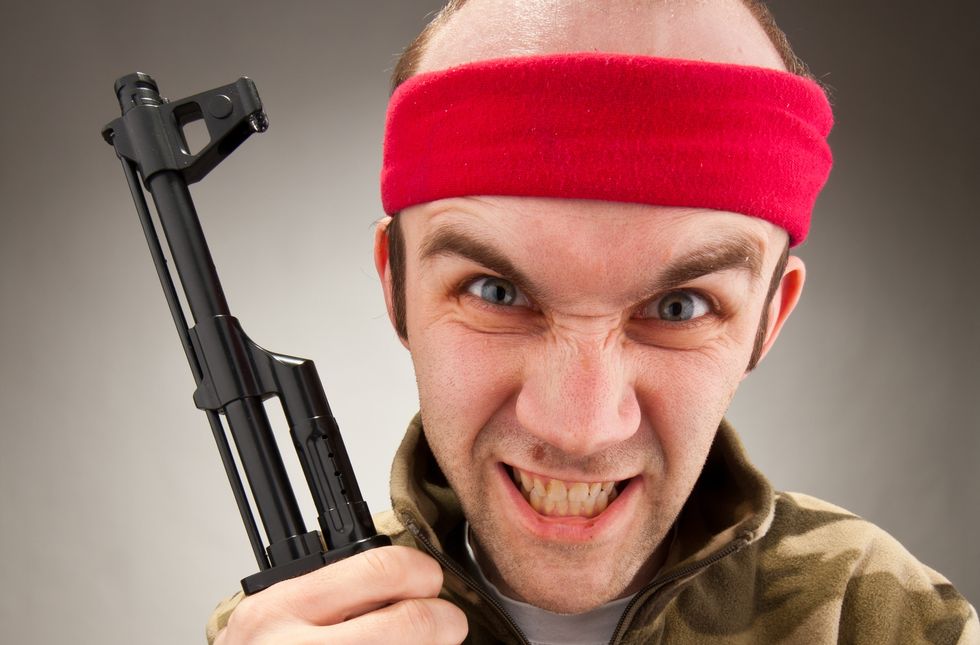 Drunk man grabs gun, chases neighbor, and screams the N-word -- then tells cops he was afraid for his life