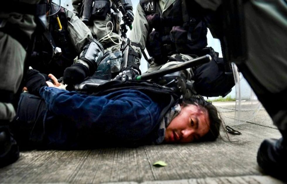 Hong Kong police fire tear gas as clashes return to city streets