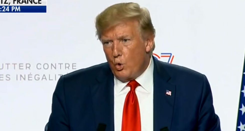 Trump press conference goes off the rails after he gets asked about Russia -- but rants about Obama instead