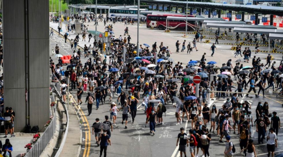 Hong Kong protesters target airport as city mops up