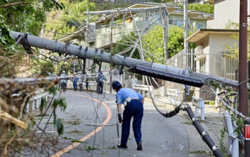 Two dead, travel chaos, after powerful typhoon pummels Tokyo