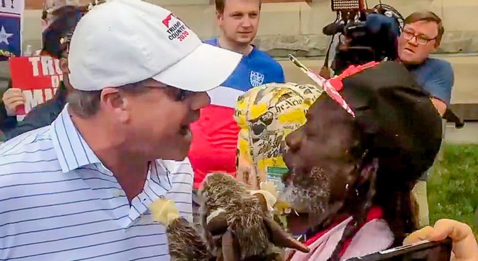 'He's a pedophile': Protester clashes with with stubborn GOP voter outside Trump's Baltimore speech