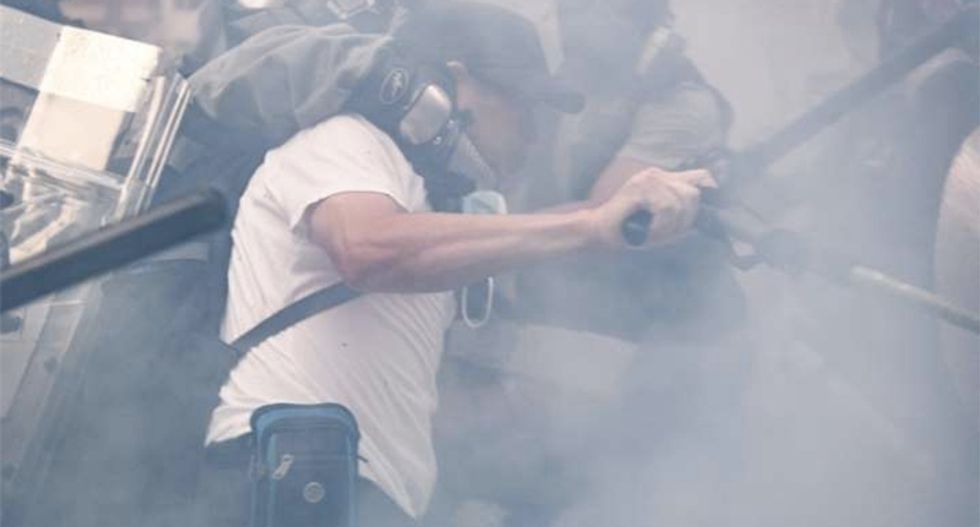 Sit-in at school of Hong Kong protester shot by police