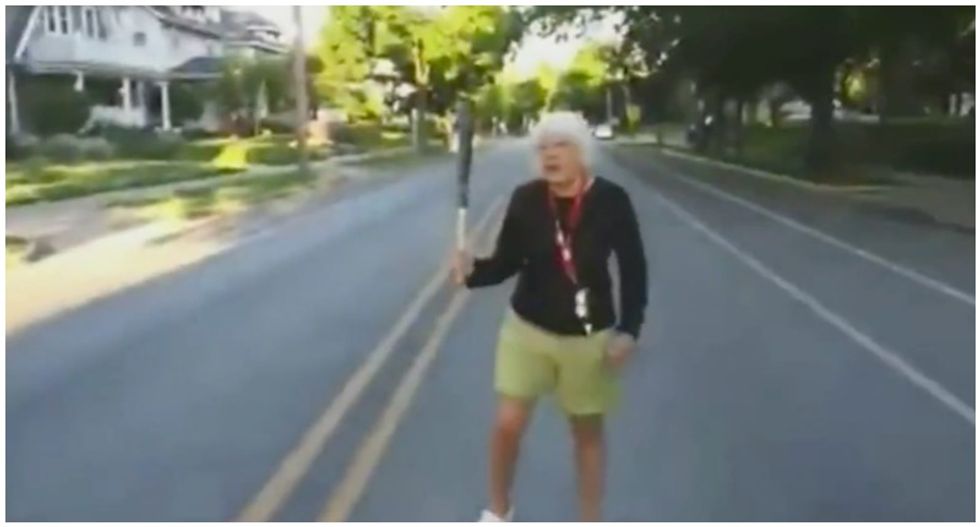 WATCH: Bat-wielding 75-year-old white woman tries to block peaceful protesters from marching