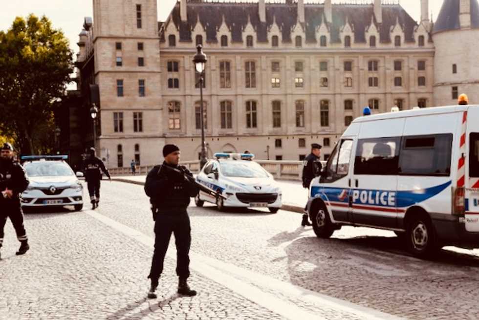 Hunt for motive of staffer who killed four at Paris police HQ