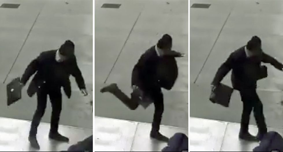 Man in suit caught on tape kicking homeless person's head in unprovoked attack