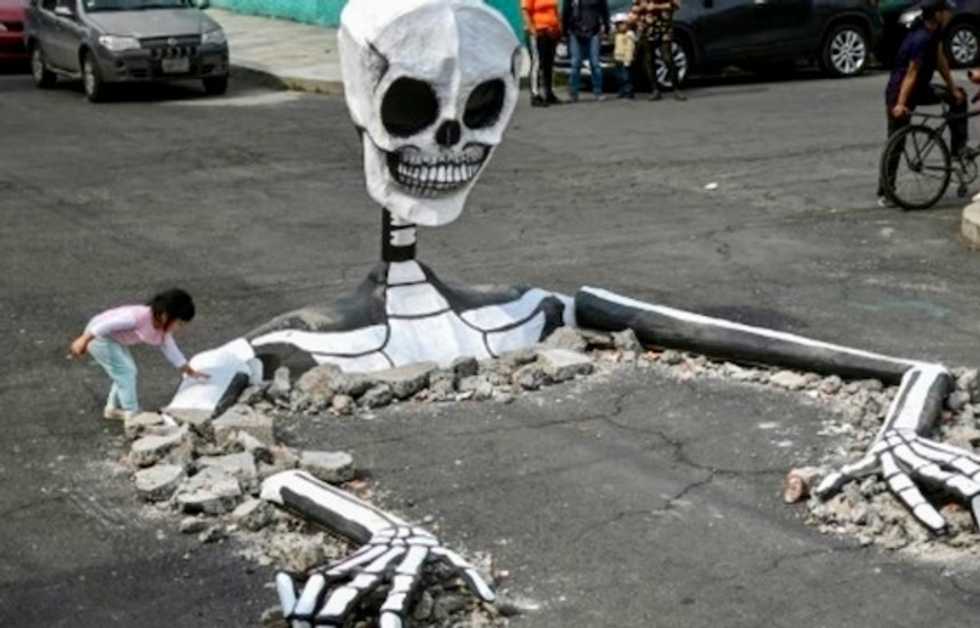 Giant skeletons come alive in Mexico for Day of the Dead