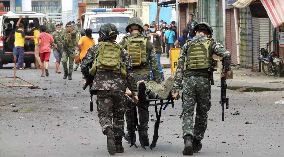 10 dead, dozens wounded in twin bombing in Philippines: military