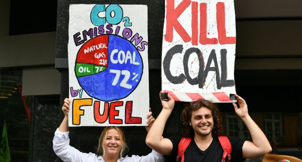 Australians protest prime minister for denying climate change as Sydney is covered in smoke from bushfires