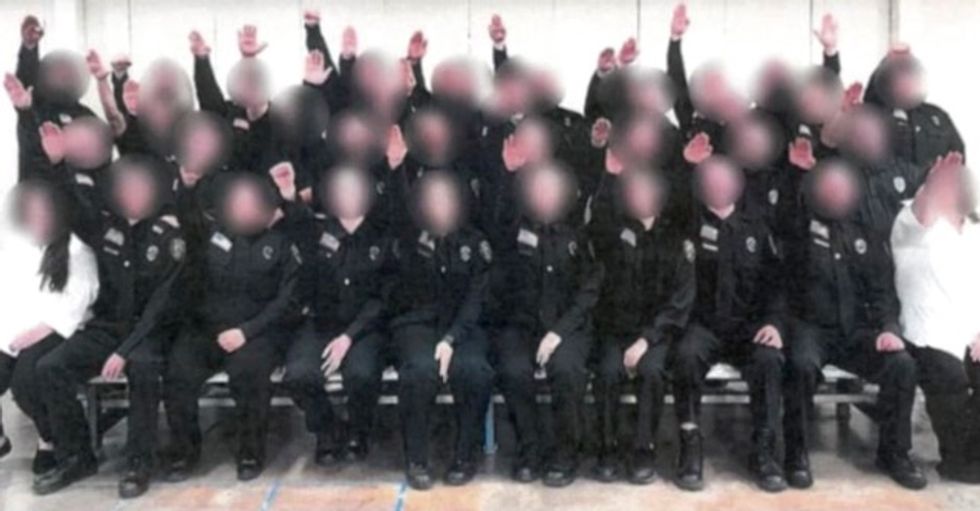 Dozens of West Virginia correction officer trainees in group photo appear to give Nazi salute