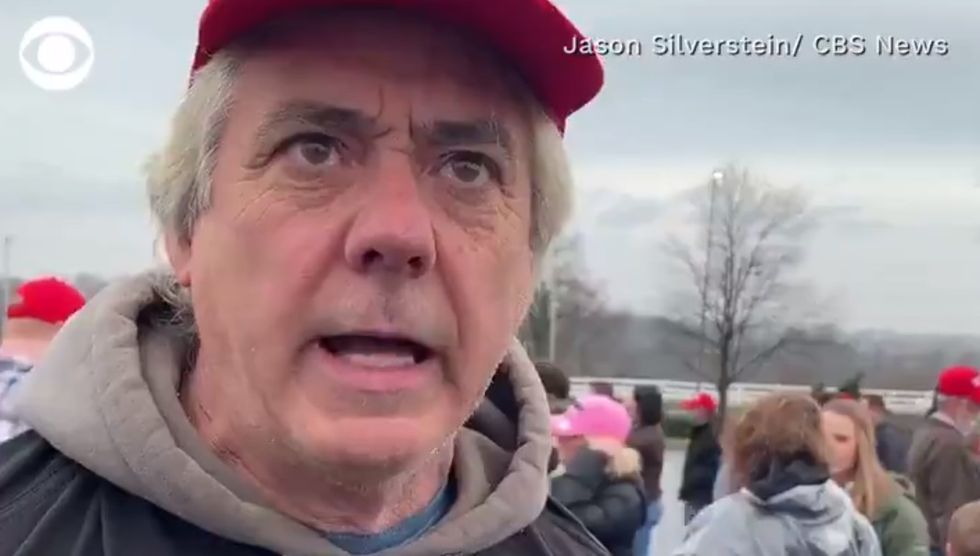 Unhinged Trump supporter yells about his .357 Magnum after reporter asks about impeachment