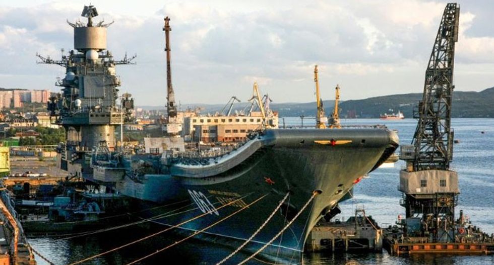 Russia's only aircraft carrier bursts into flames while sitting in port