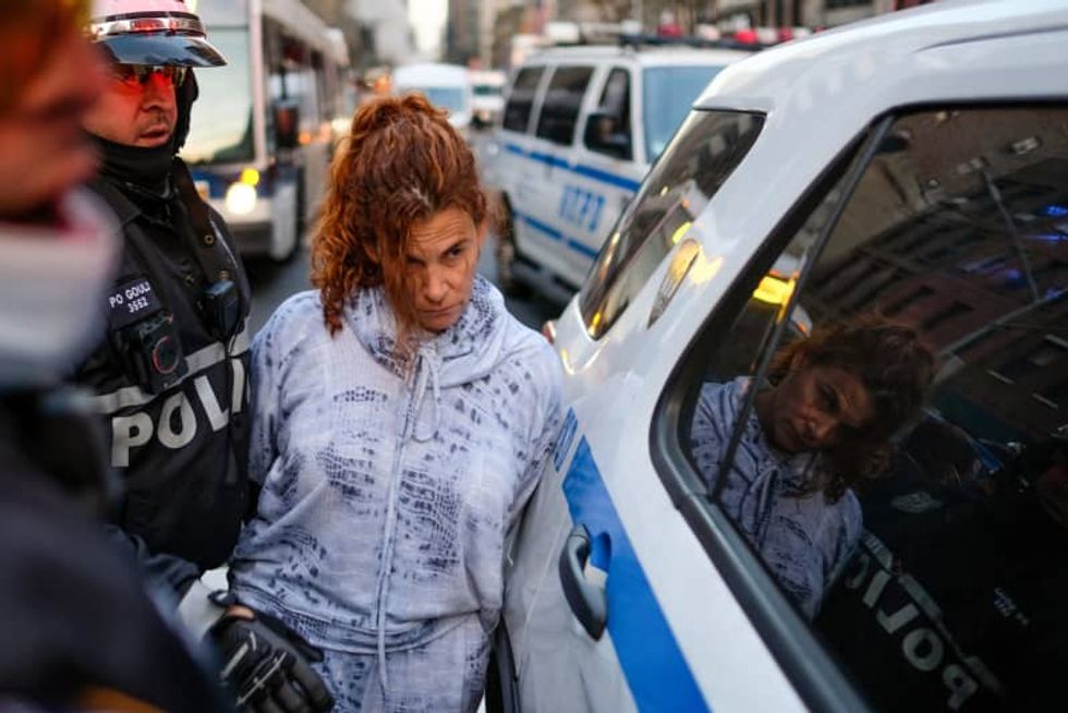 Driver charged with plowing through protesters in NYC