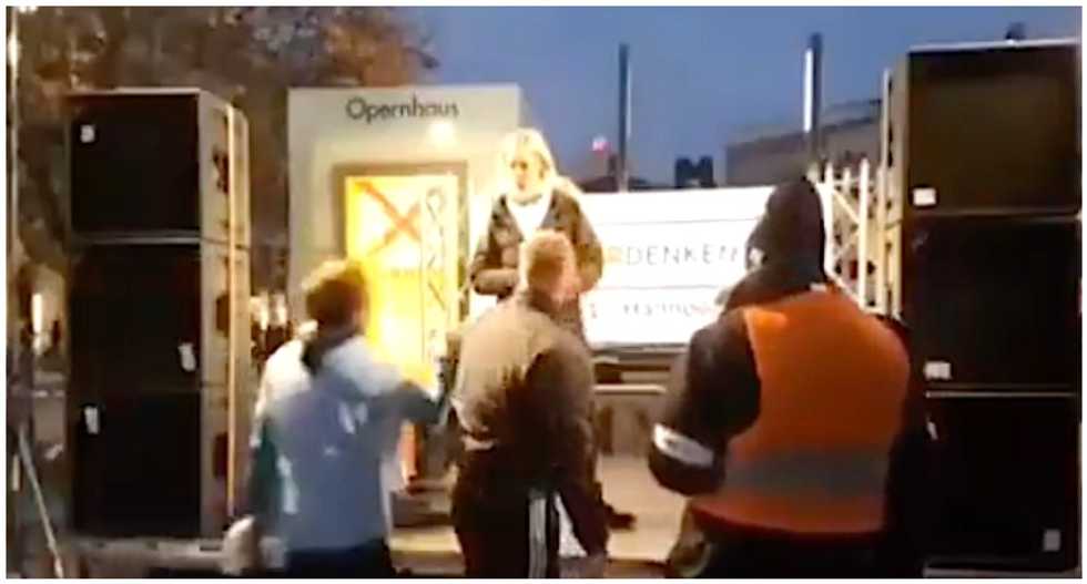 Security guard interrupts COVID-denier's speech and quits on the spot: 'She's trivializing the Holocaust'