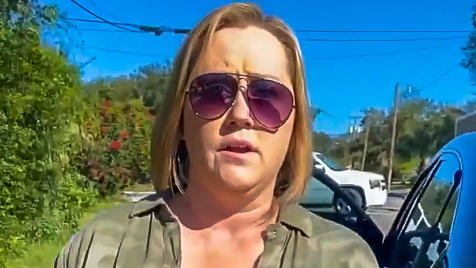 White woman caught stealing anti-Trump sign lectures Black man for 'disrespecting the current president'
