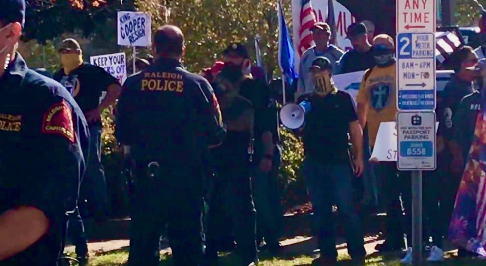 ‘We will exterminate you’: Proud Boys and other right-wing Trump diehards confront counter-protesters at Raleigh rally