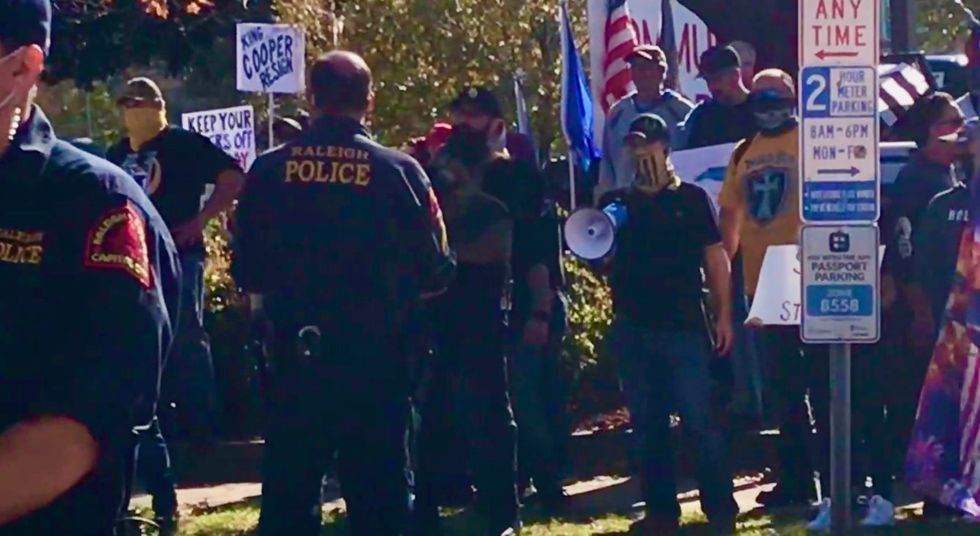 ‘We will exterminate you’: Proud Boys and other right-wing Trump diehards confront counter-protesters at Raleigh rally