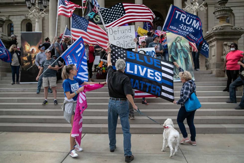 Michigan officials defend Detroit's vote count from Trump lawsuit -- and debunk dead voter claim
