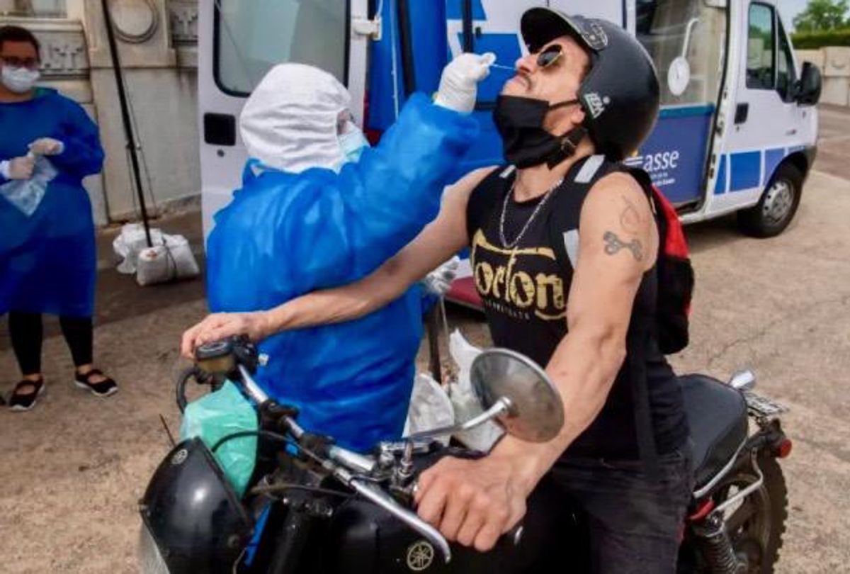 US authorizes second vaccine as countries tighten holiday curbs