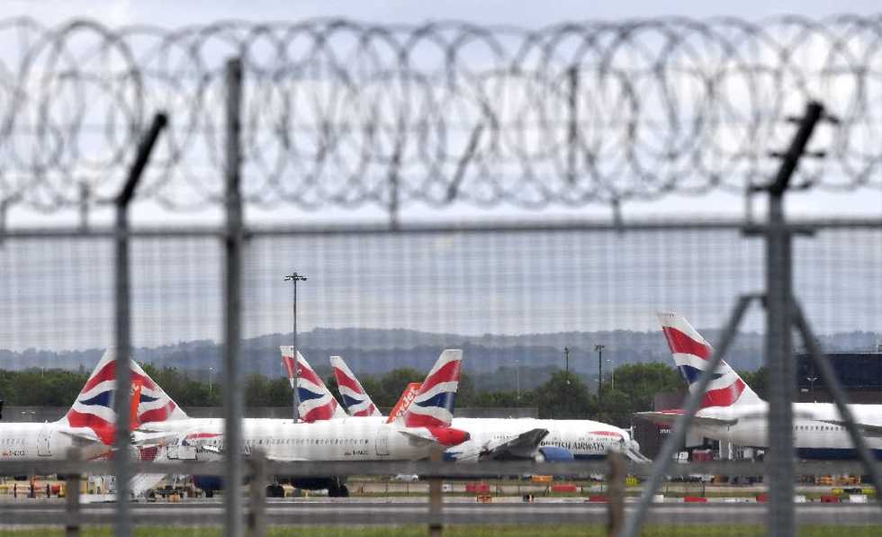 Britain holds crisis meeting over virus travel ban