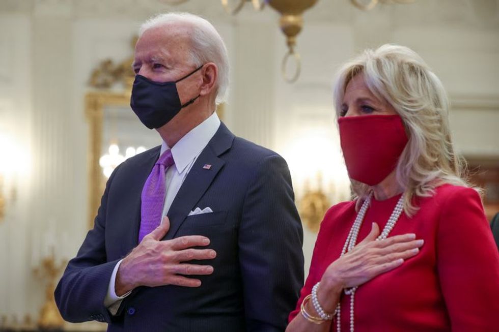 Biden launches sweeping COVID-19 changes on first full day in White House
