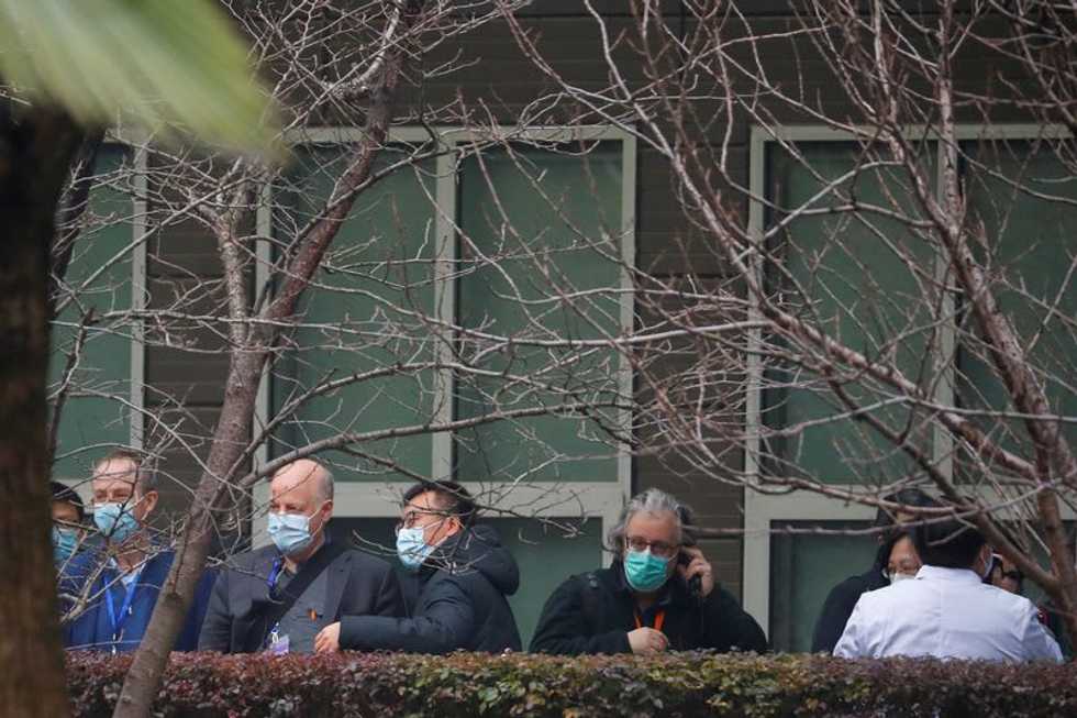 WHO-led COVID-19 probe team in China visits animal health facility
