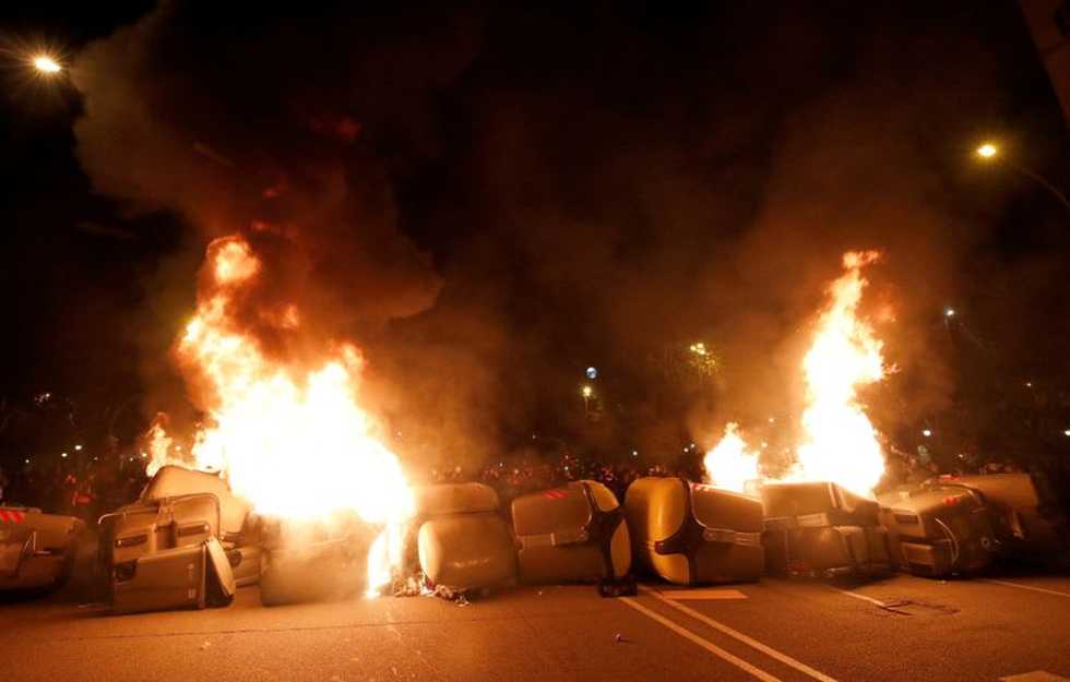 Protesters throw stones at police and neighbours over jailed Spanish rapper