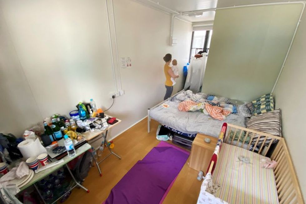 Hong Kong's tough COVID-19 rules see babies isolated, families cramped in tiny spaces