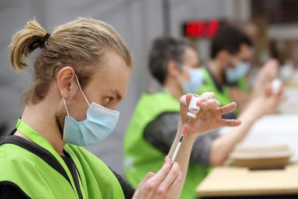 As vaccine battle with UK deepens, EU blames AstraZeneca