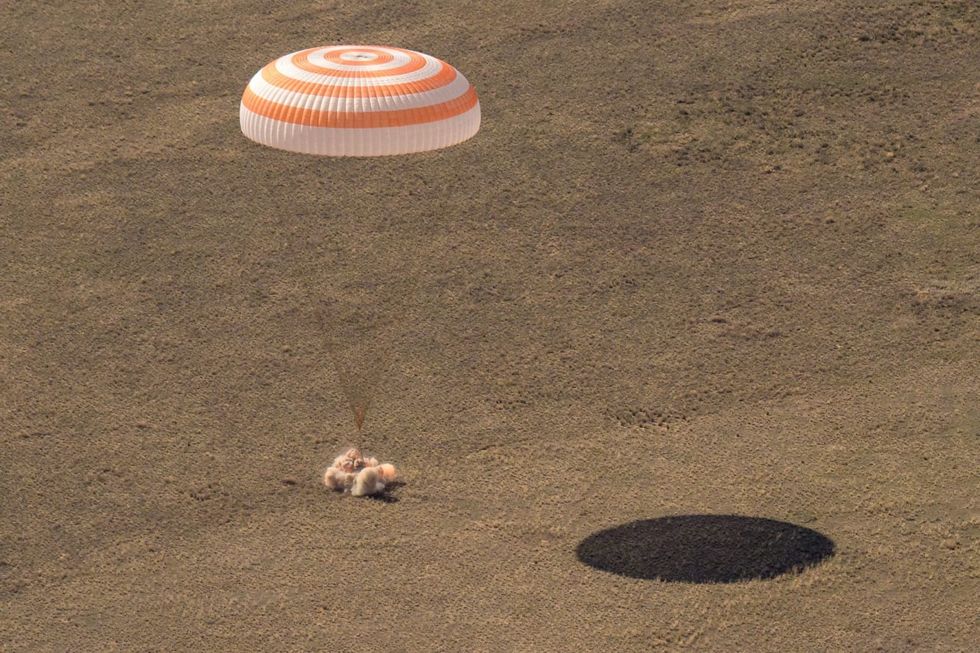 Three space station crew members land safely on Earth