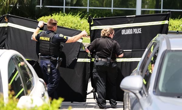 Suspect in US immigration office shooting fired gun as victim lay on the ground, records say