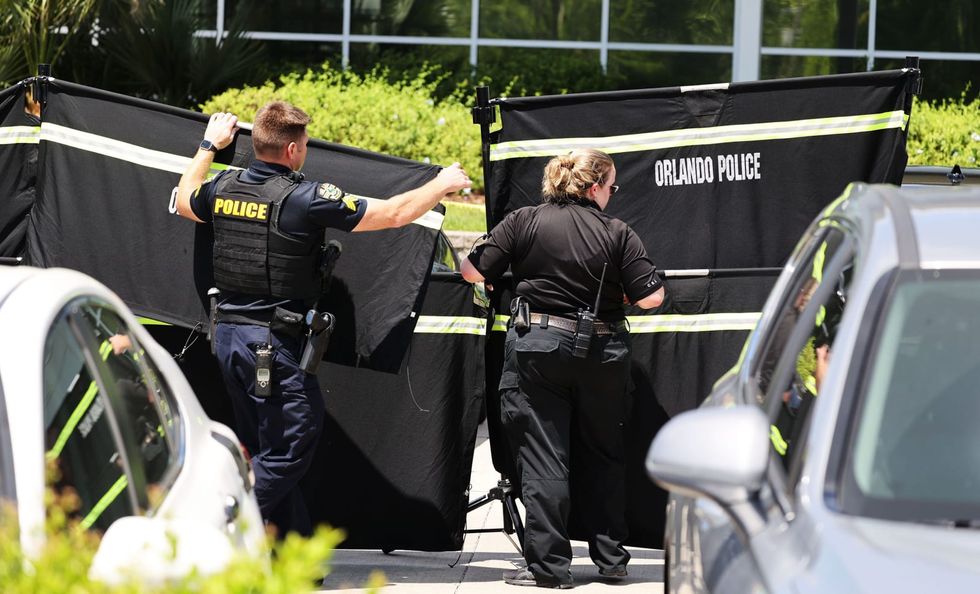 Suspect in US immigration office shooting fired gun as victim lay on the ground, records say